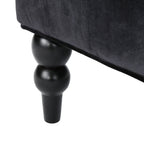 Canapé à oreilles hautes capitonné en velours noir
