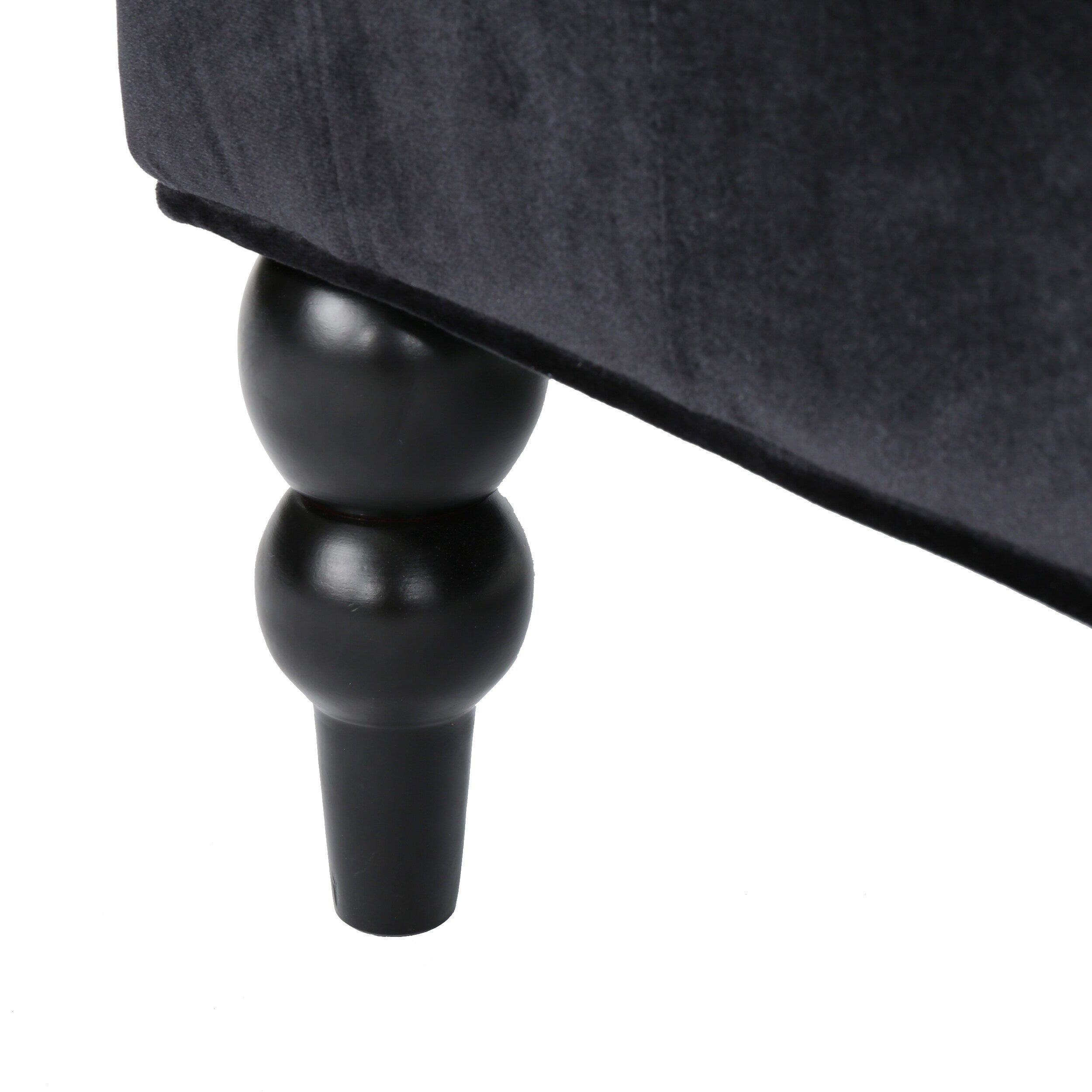 Canapé à oreilles hautes capitonné en velours noir