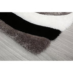 Tapis à poils longs Mateos au design abstrait
