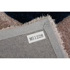 Tapis à poils longs Mateos au design abstrait
