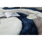 Tapis à poils longs Mateos au design abstrait