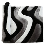 Tapis à poils longs Mateos au design abstrait