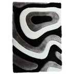 Tapis à poils longs Mateos au design abstrait