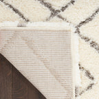 Tapis Nourison luxueux à poils longs et ultra moelleux, motif géométrique abstrait