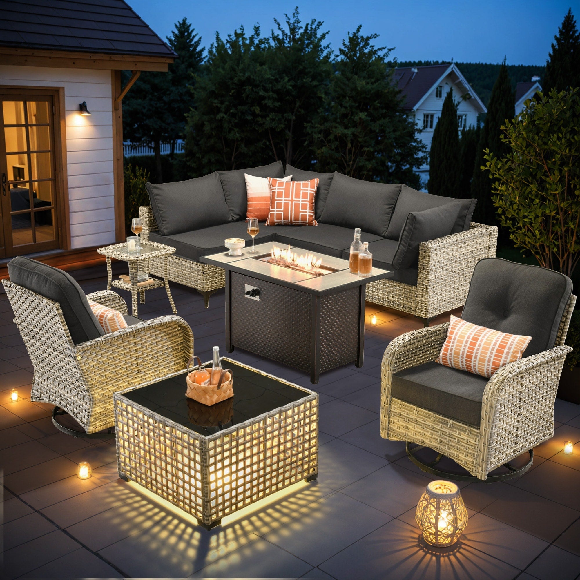 Ensemble de 9 chaises pivotantes d'extérieur en osier OVIOS avec table à feu